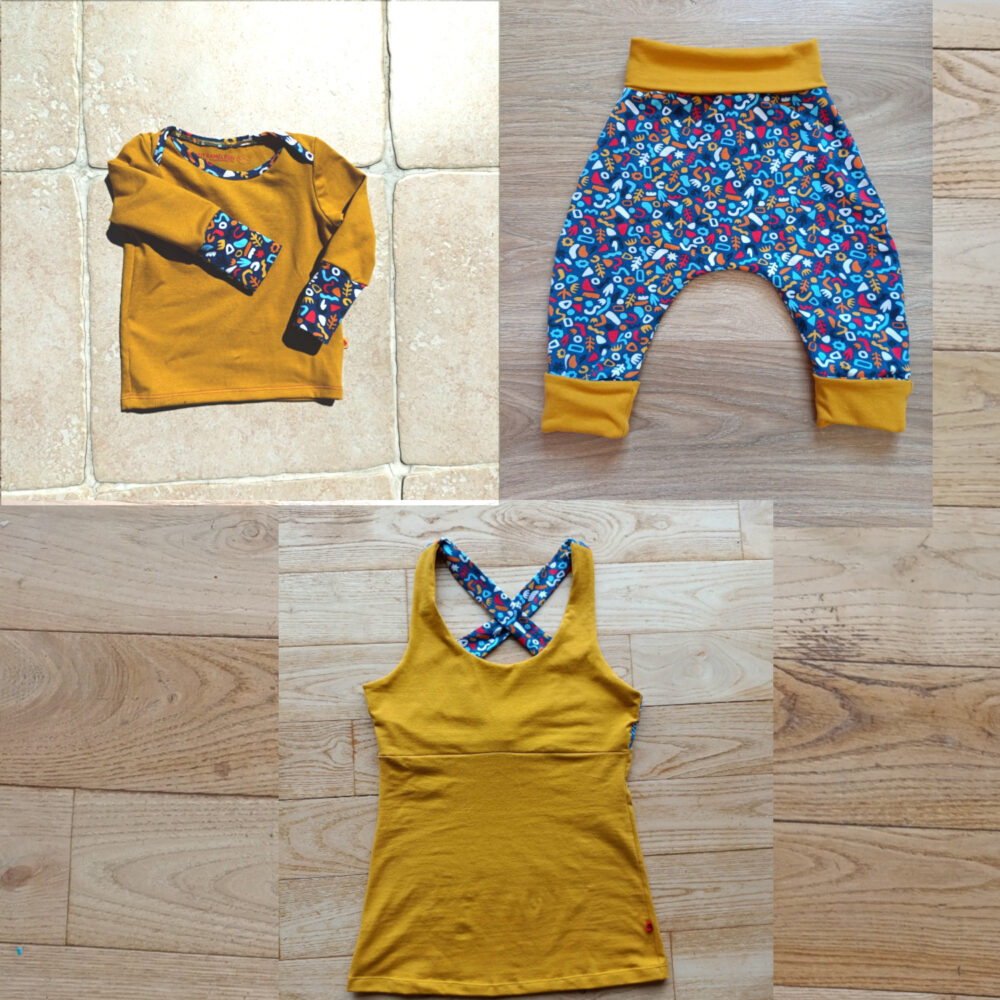 différents vêtements assortis motifs colorés : tee-shirt bébé, sarouel et débardeur femme dos croisé