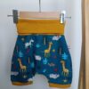 short évolutif bébé - animaux - début de taille, suspendu sur un cintre